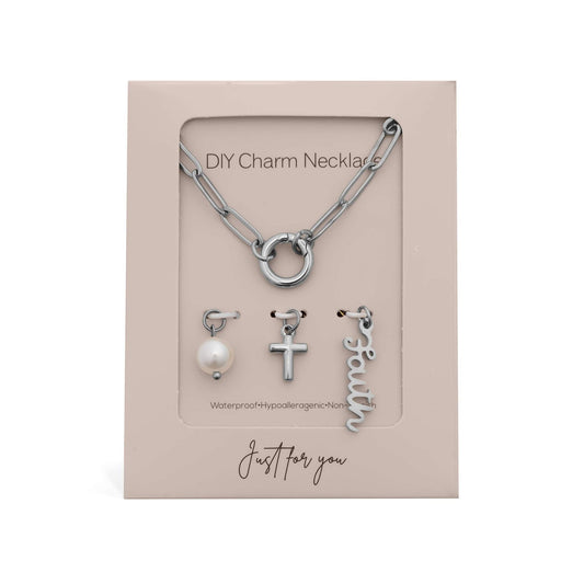 Silver DIY faith necklace gift set with charms including a cross, pearl, and the word 'faith'.