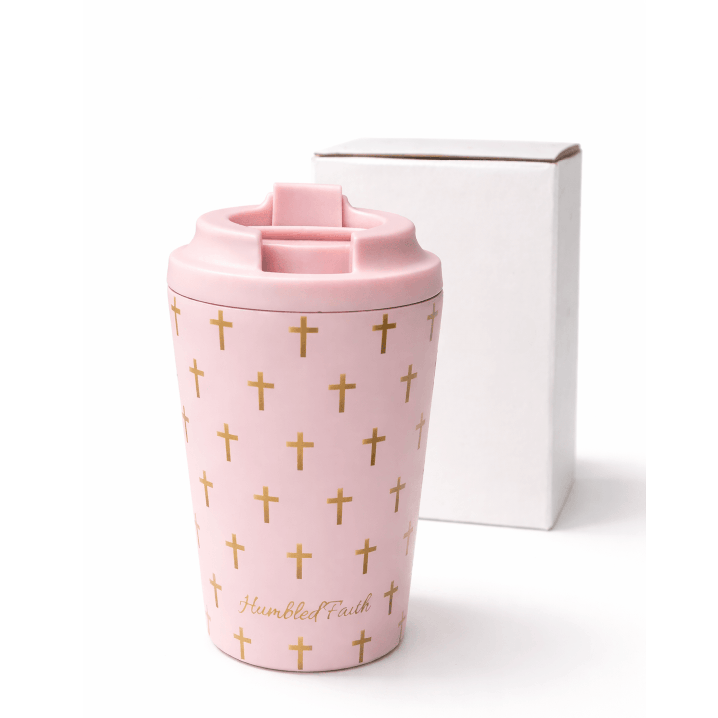 Humbled Faith travel mug in soft baby pink with gold crosses and HF monogram, stylish and functional for travel.